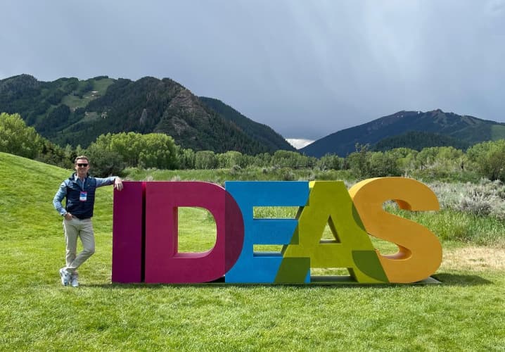 Tripp Donnelly standing next to the IDEAS sculpture at the Aspen Ideas festival